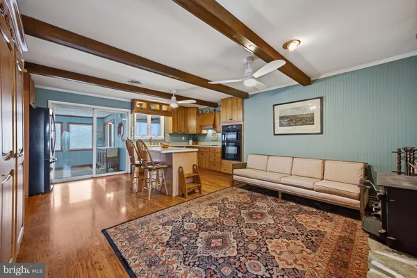 a living room with furniture fireplace and flat screen tv