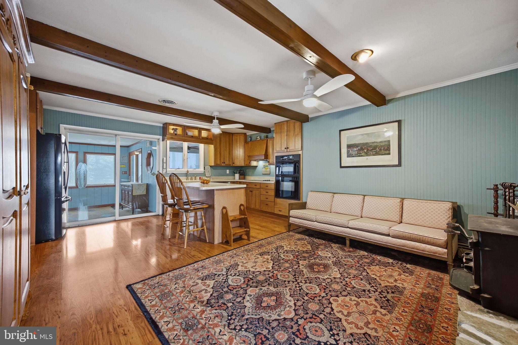 3975 Street Road Street, MD 21154 - Photo 13 of 78 a living room with furniture and a wooden floor