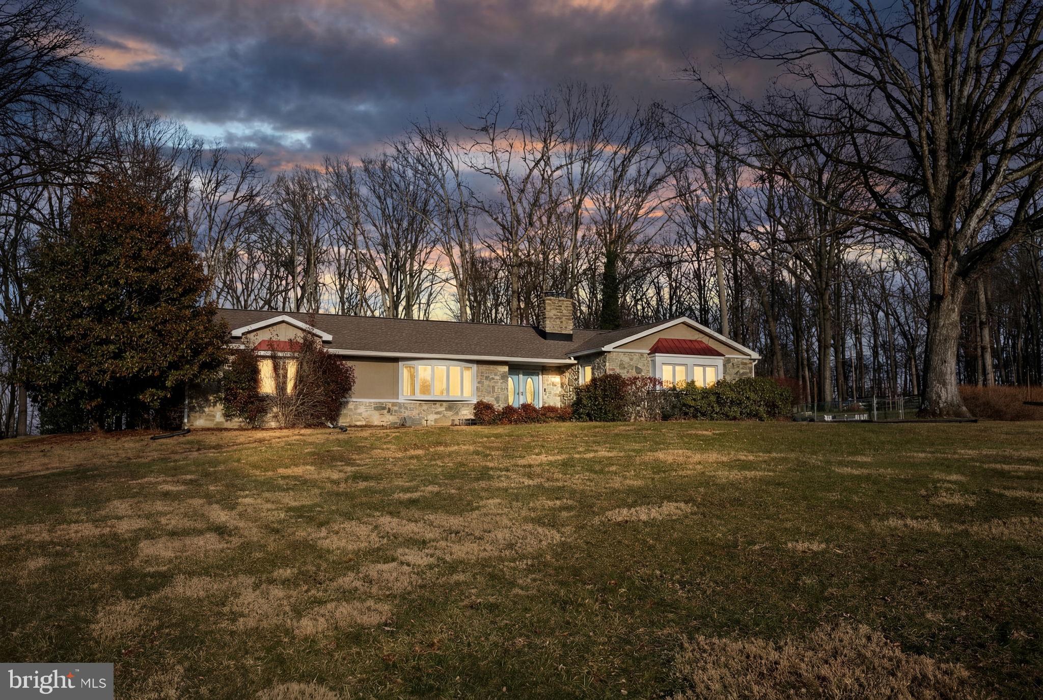 3975 Street Road Street, MD 21154 - Photo 2 of 78 a front view of a house with a yard and large trees