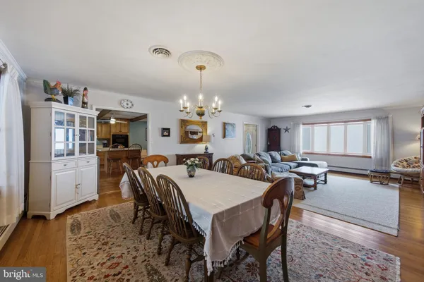 a living room with furniture ceiling fan and a rug