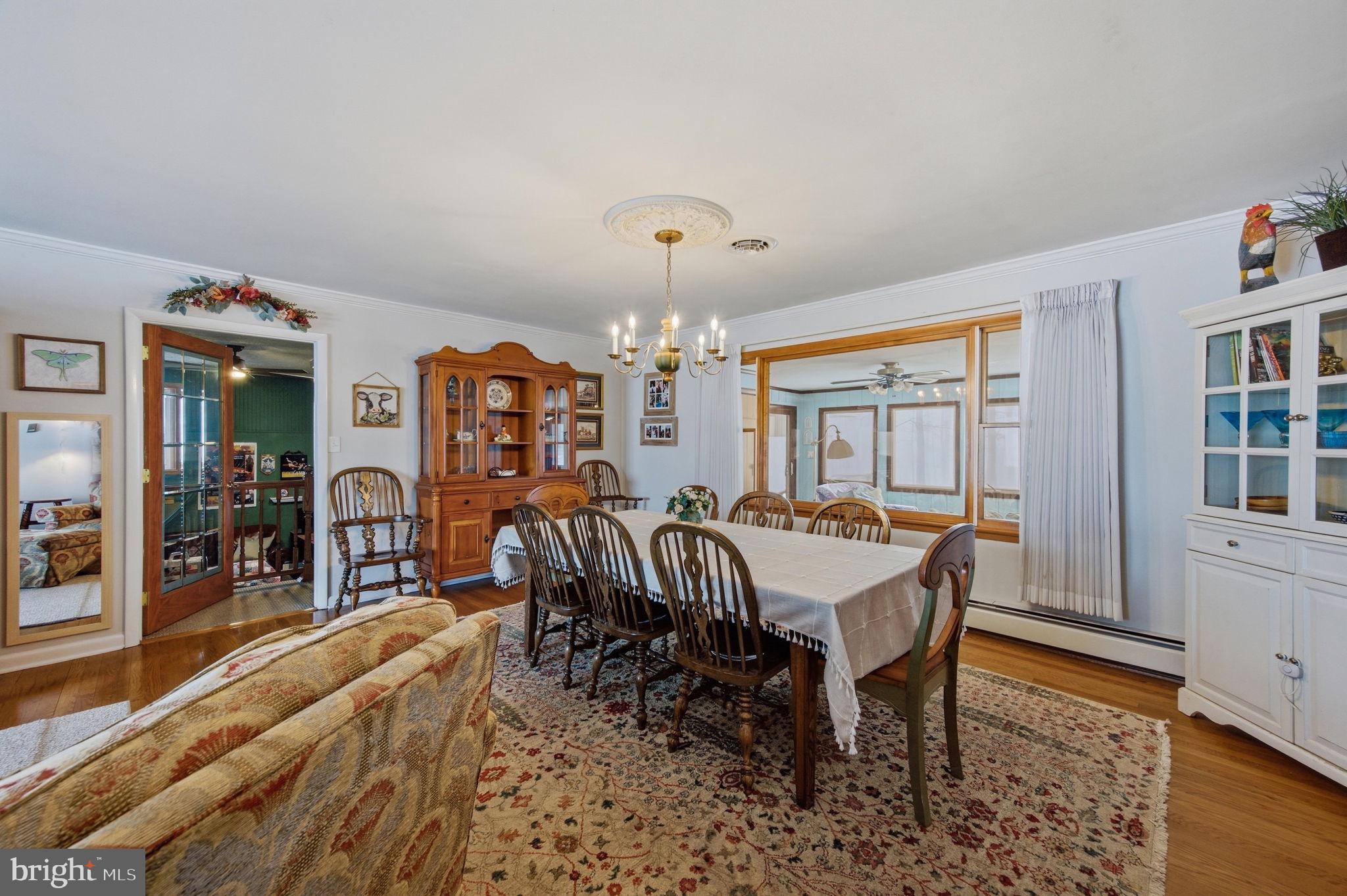3975 Street Road Street, MD 21154 - Photo 25 of 78 a view of a dining room with furniture and chandelier