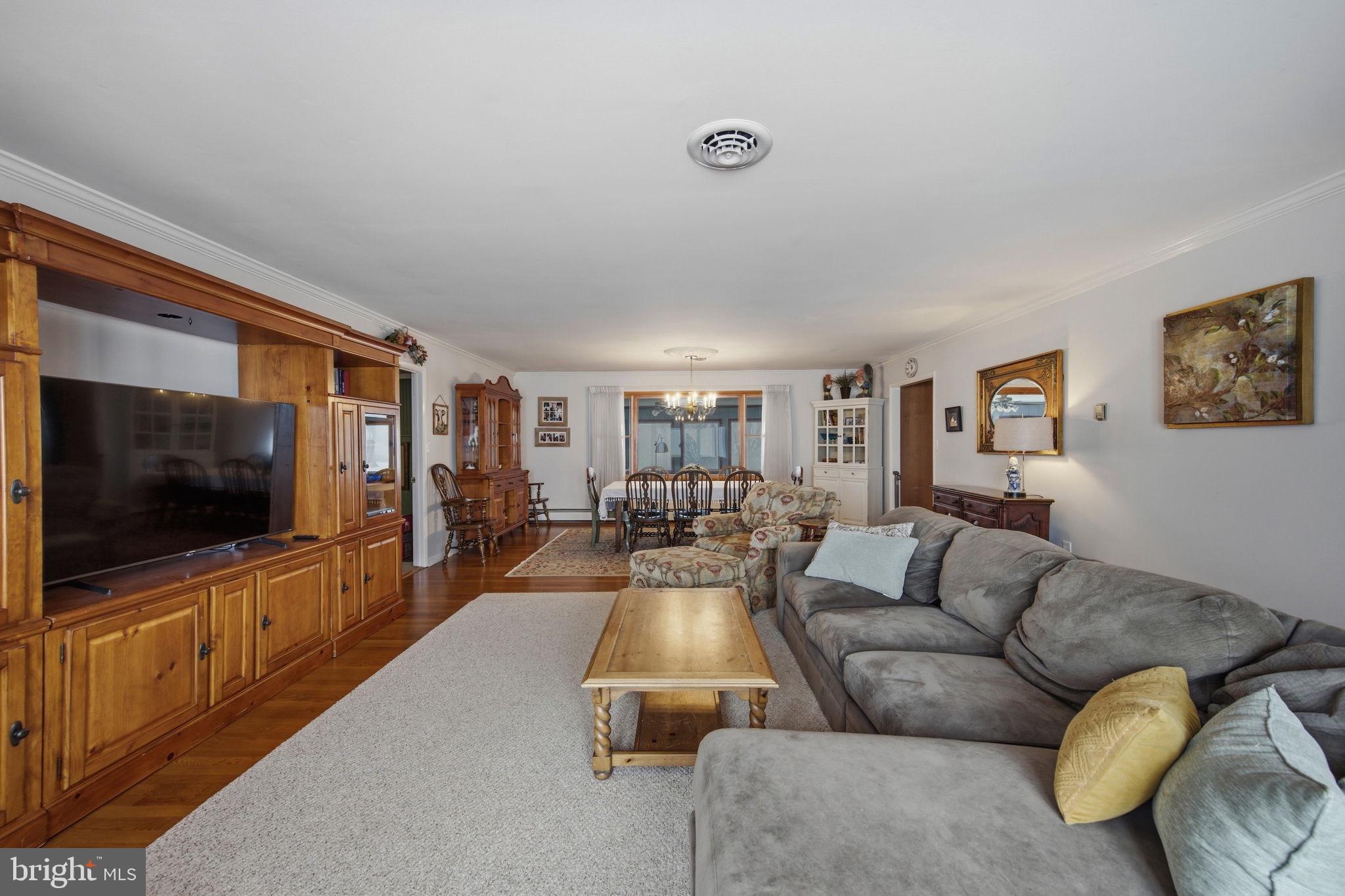3975 Street Road Street, MD 21154 - Photo 27 of 78 a living room with furniture and a flat screen tv