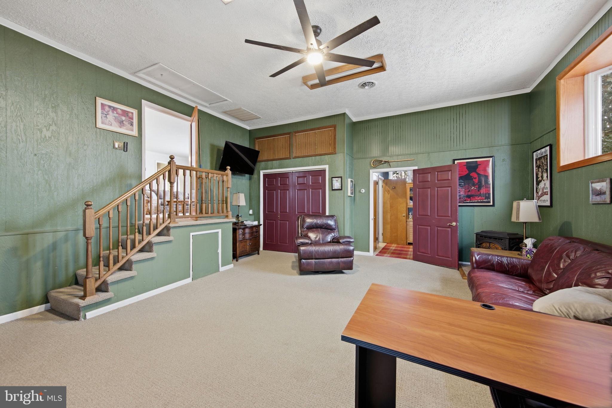 3975 Street Road Street, MD 21154 - Photo 35 of 78 a living room with furniture and a flat screen tv