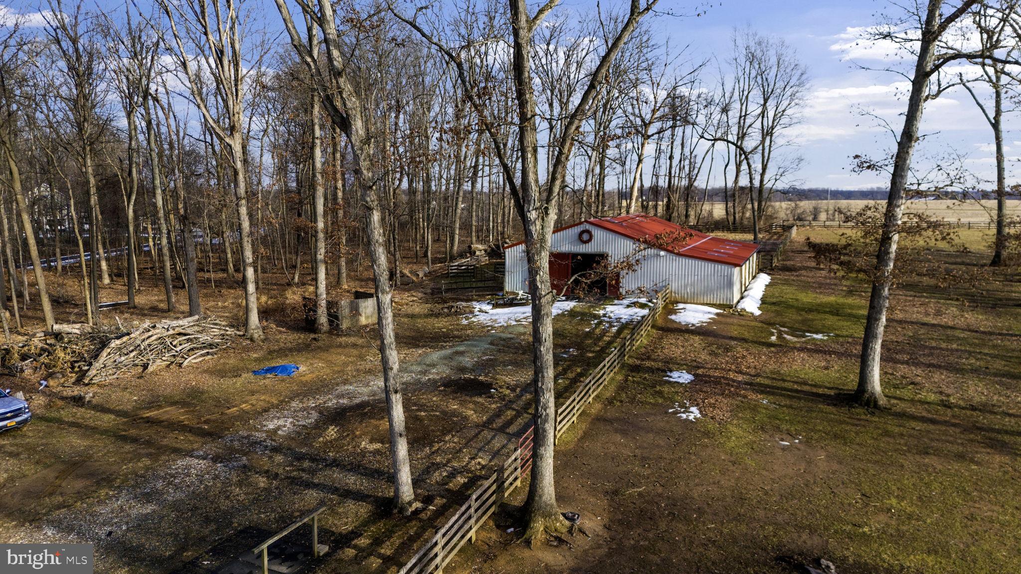 3975 Street Road Street, MD 21154 - Photo 62 of 78 a backyard of a house with table and chairs