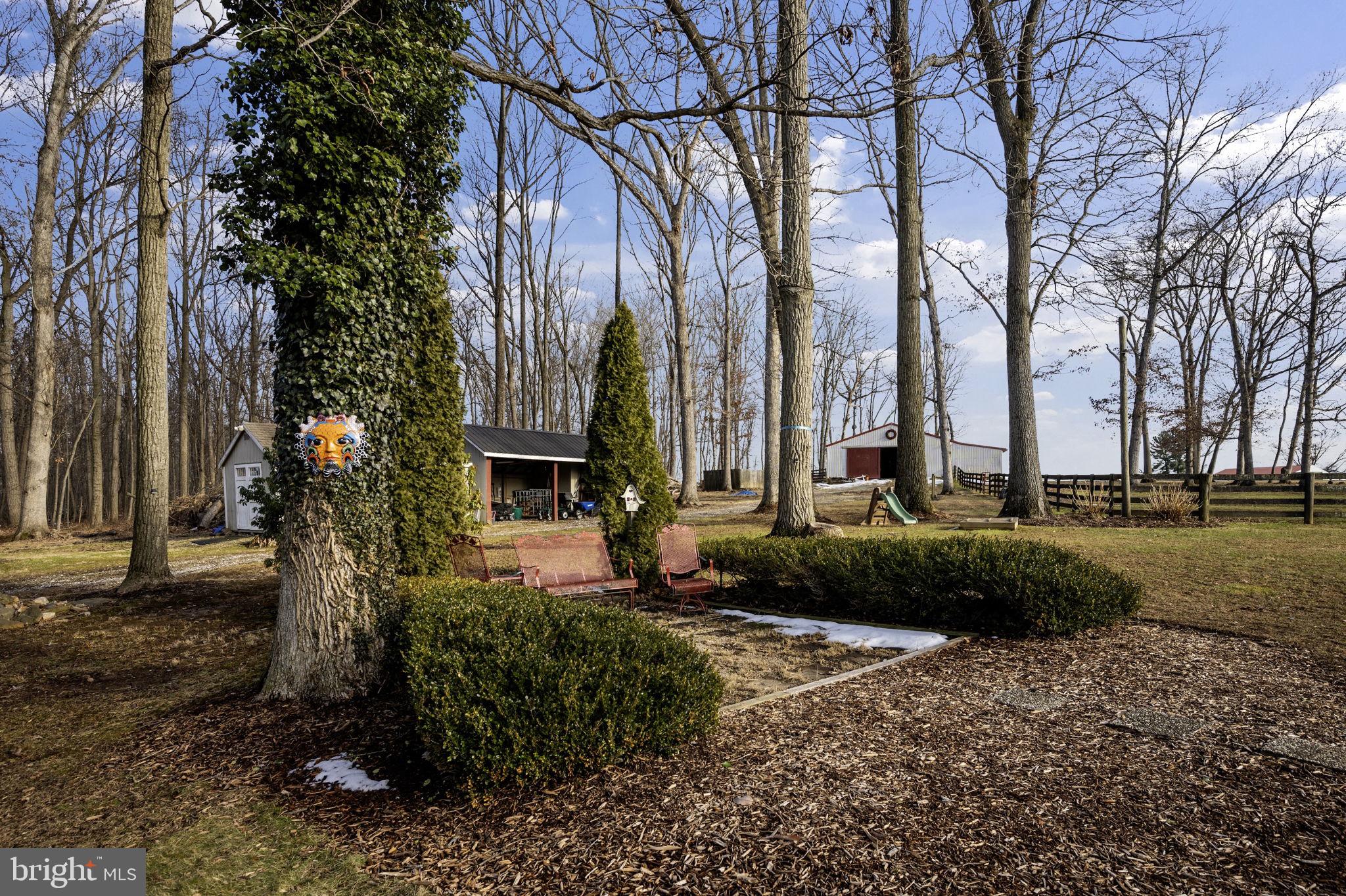3975 Street Road Street, MD 21154 - Photo 72 of 78 a front view of a house with a yard and tree s