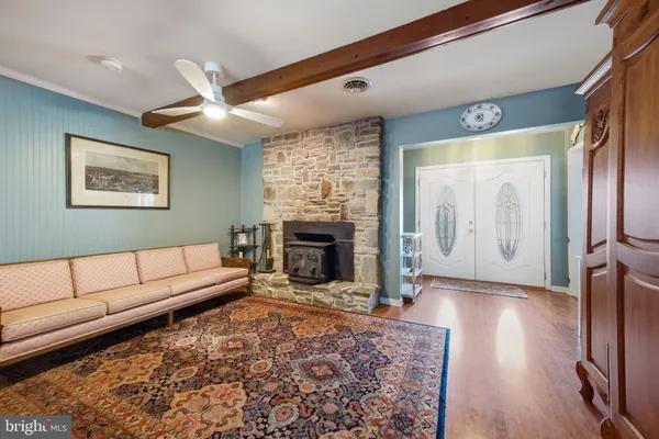 a kitchen with stainless steel appliances granite countertop a stove and cabinets