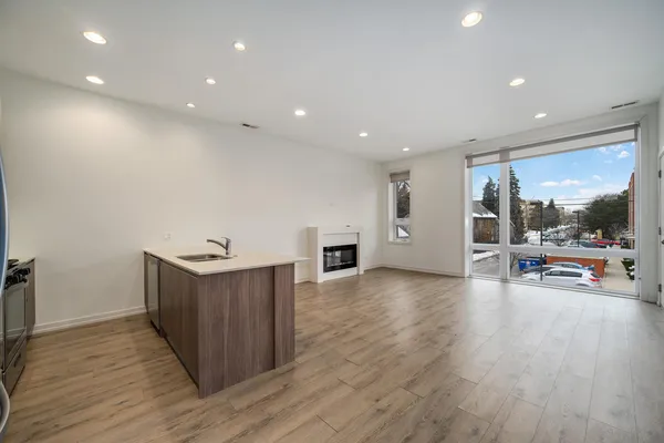 a view of a living room a patio and a wooden floor