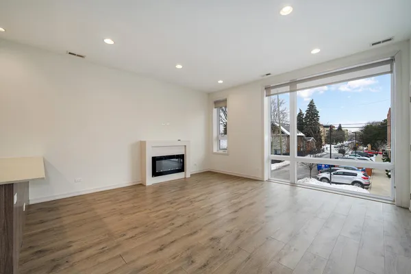 a view of a livingroom with furniture water view and windows
