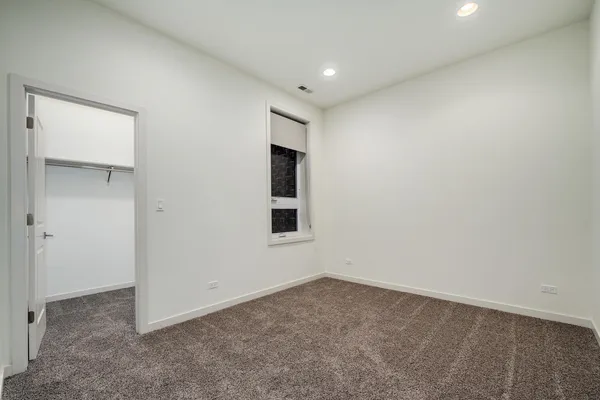 an empty room with a empty space and window