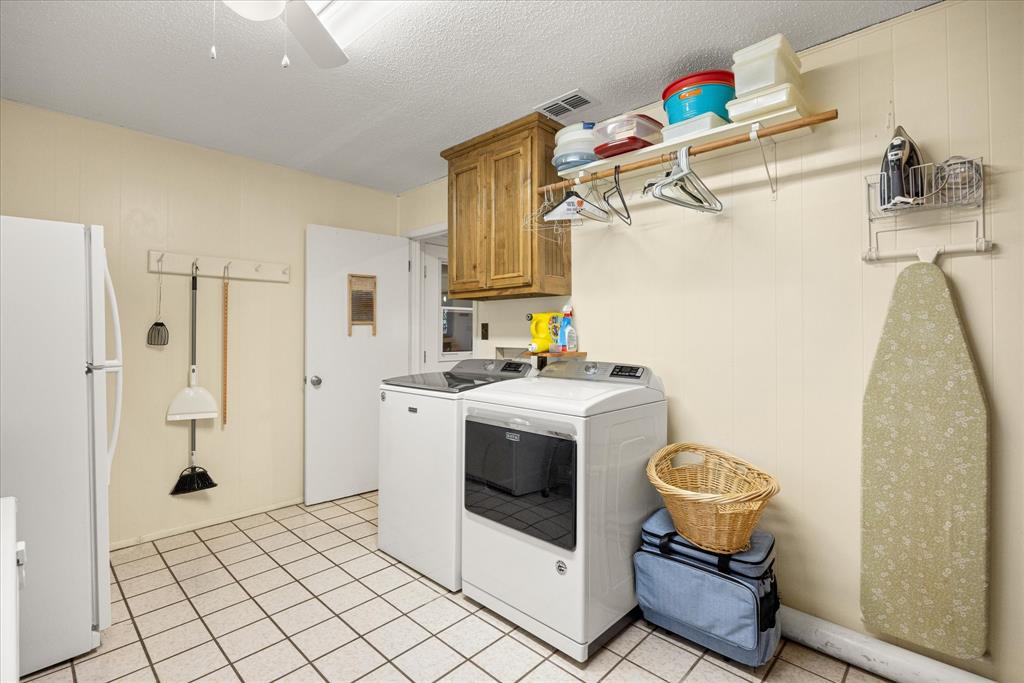 17305 Highway 281 Hico, TX 76457 - Photo 17 of 28 a view of a storage & utility room with sink dryer and washer