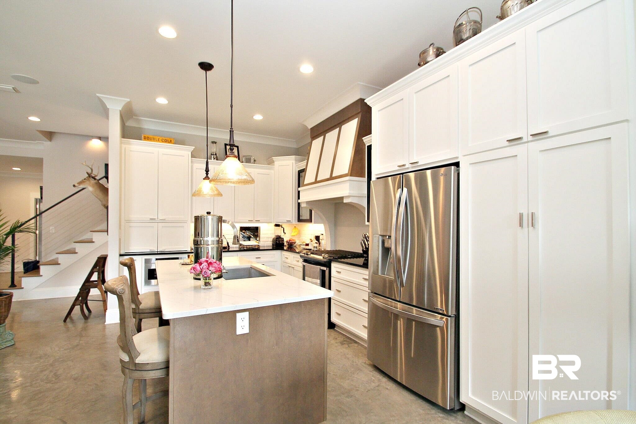 3415 Rue Royal Mobile, AL 36693 - Photo 6 of 31 Kitchen with ornamental molding, finished concrete flooring, appliances with stainless steel finishes, and tasteful backsplash