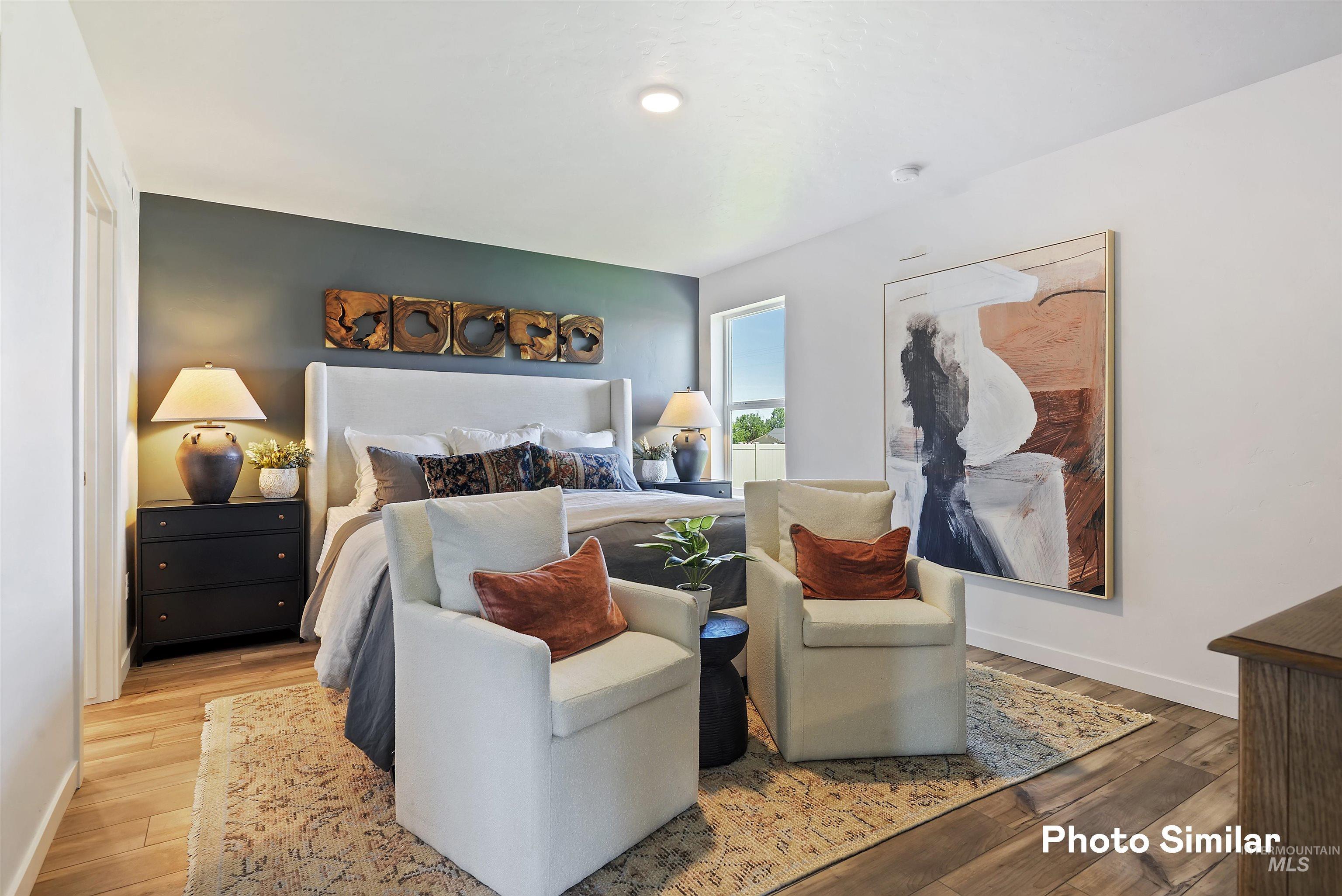 15182 Cumulus Way Caldwell, ID 83607 - Photo 11 of 26 Bedroom with baseboards and wood-type flooring