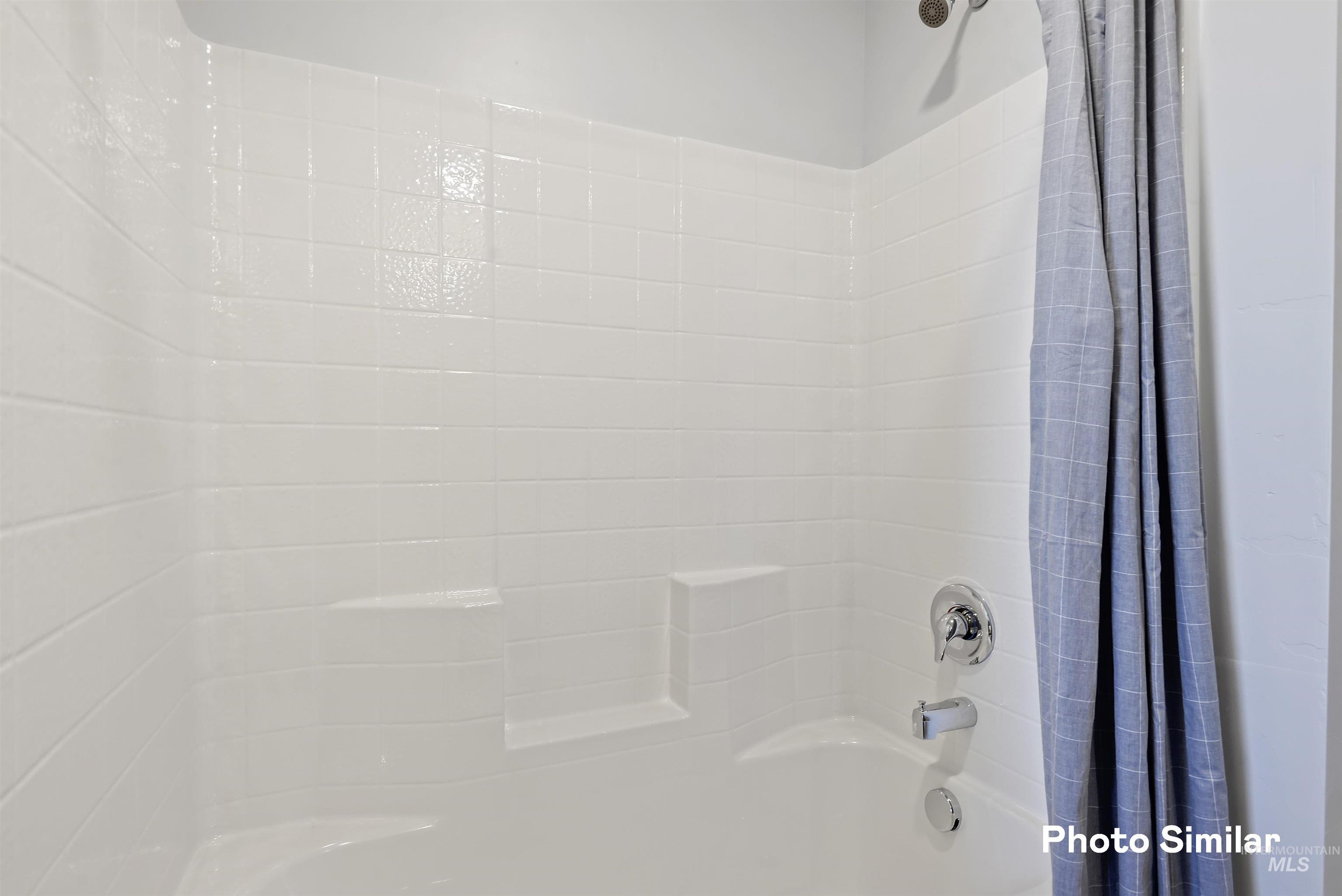 15182 Cumulus Way Caldwell, ID 83607 - Photo 14 of 26 Bathroom featuring shower / tub combo with curtain