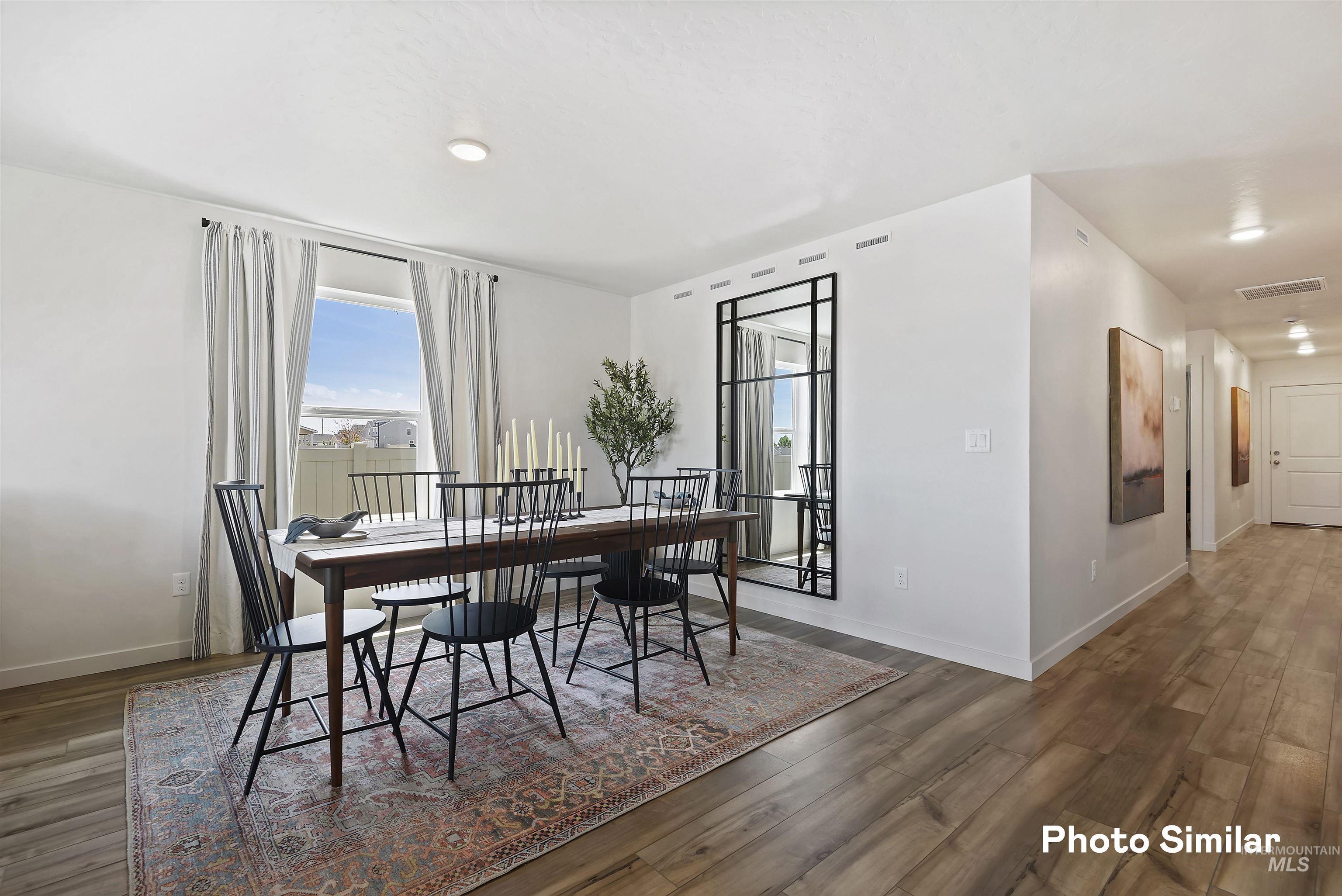 15182 Cumulus Way Caldwell, ID 83607 - Photo 20 of 26 Dining space featuring dark wood finished floors and baseboards