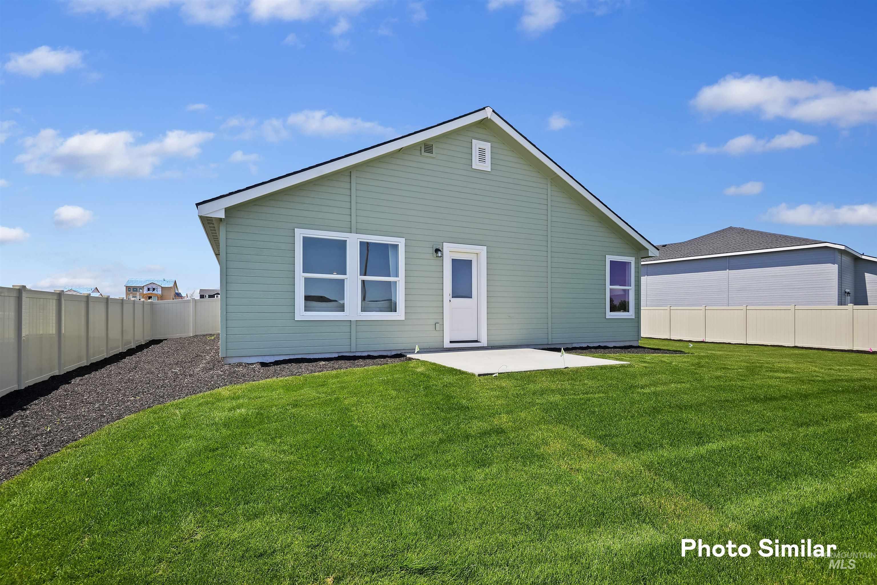 15182 Cumulus Way Caldwell, ID 83607 - Photo 22 of 26 Back of property with a patio area and a fenced backyard