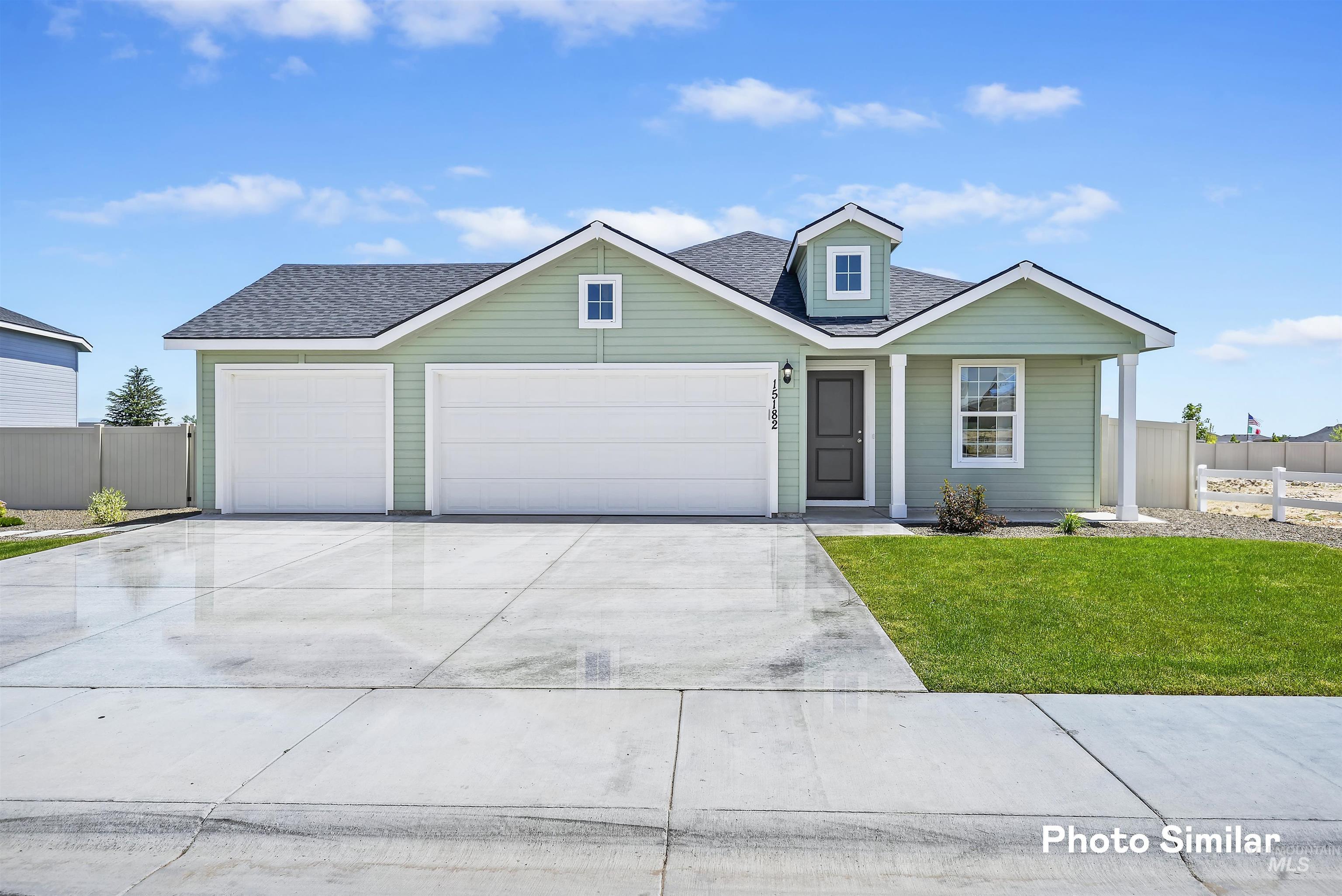 15182 Cumulus Way Caldwell, ID 83607 - Photo 25 of 26 View of front of home with a garage, a shingled roof, and concrete driveway