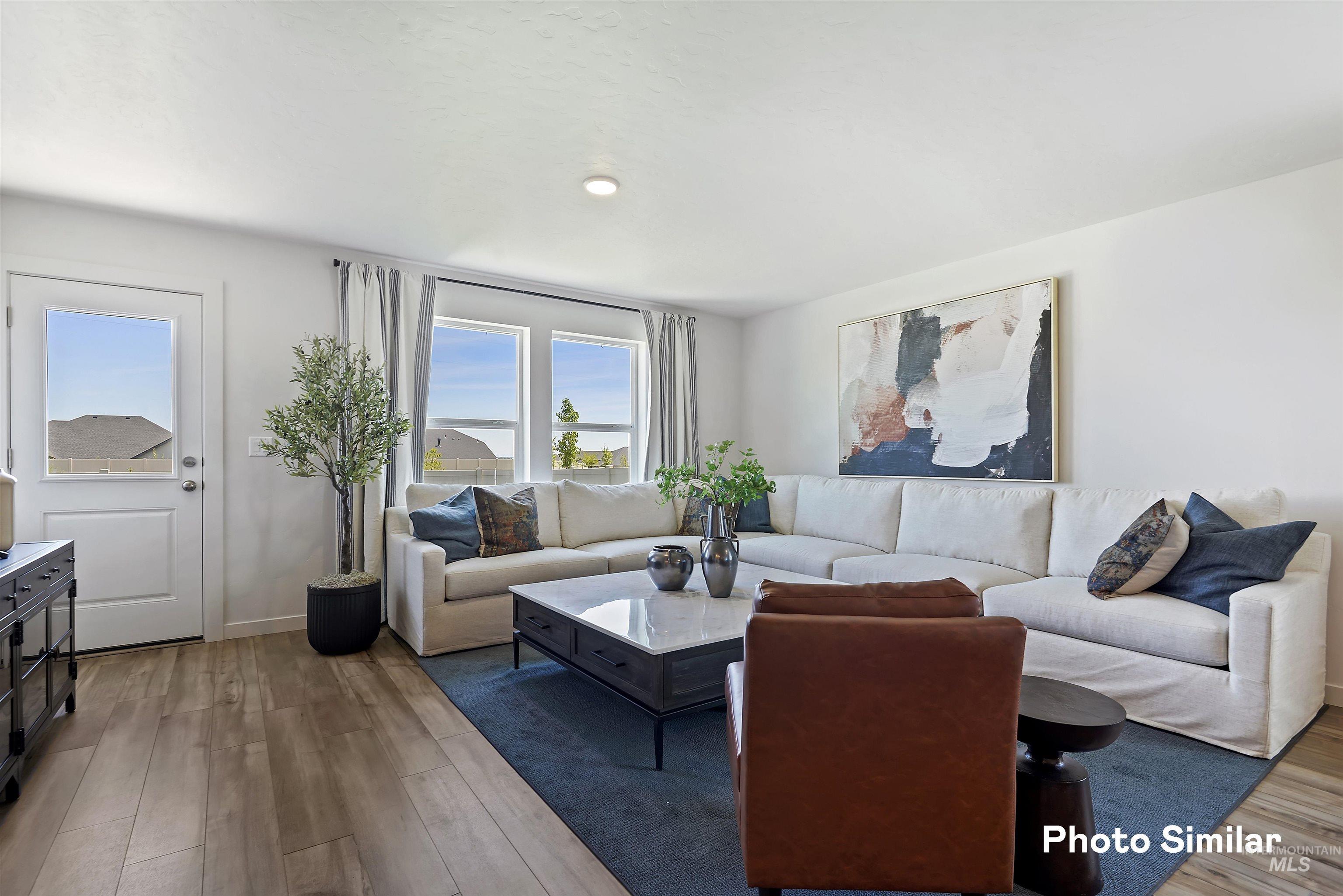 15182 Cumulus Way Caldwell, ID 83607 - Photo 3 of 26 Living area with wood finished floors and baseboards