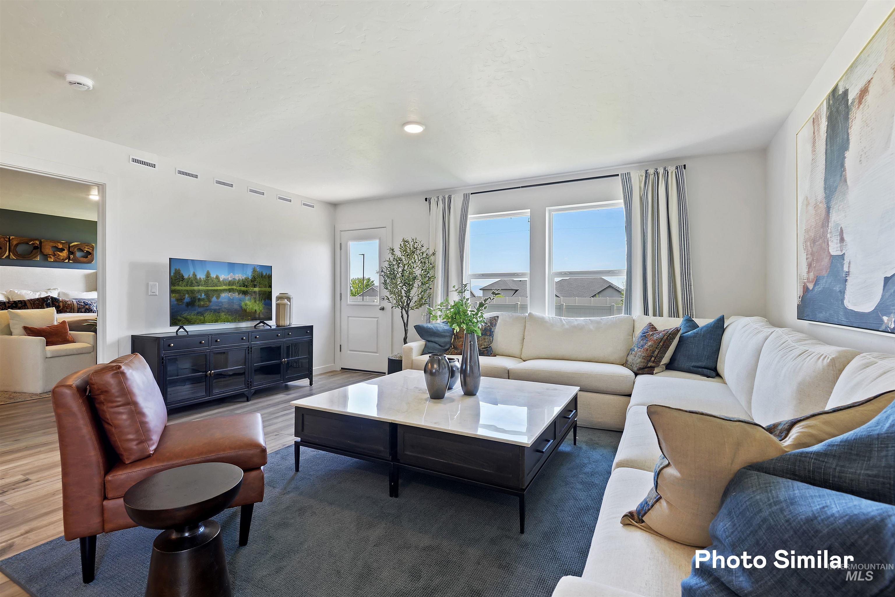 15182 Cumulus Way Caldwell, ID 83607 - Photo 4 of 26 Living area featuring wood finished floors