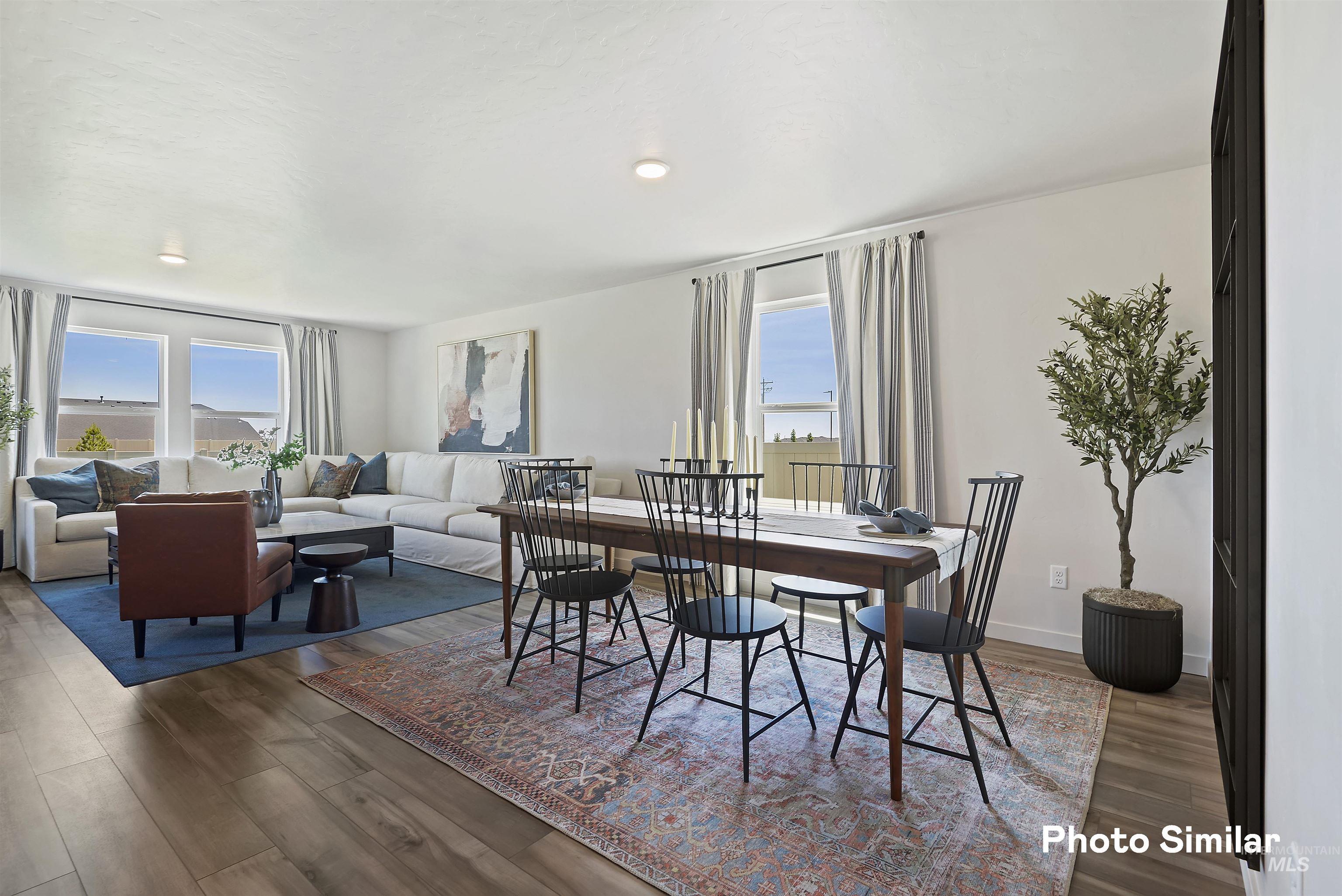 15182 Cumulus Way Caldwell, ID 83607 - Photo 5 of 26 Dining space with plenty of natural light and dark wood-style flooring