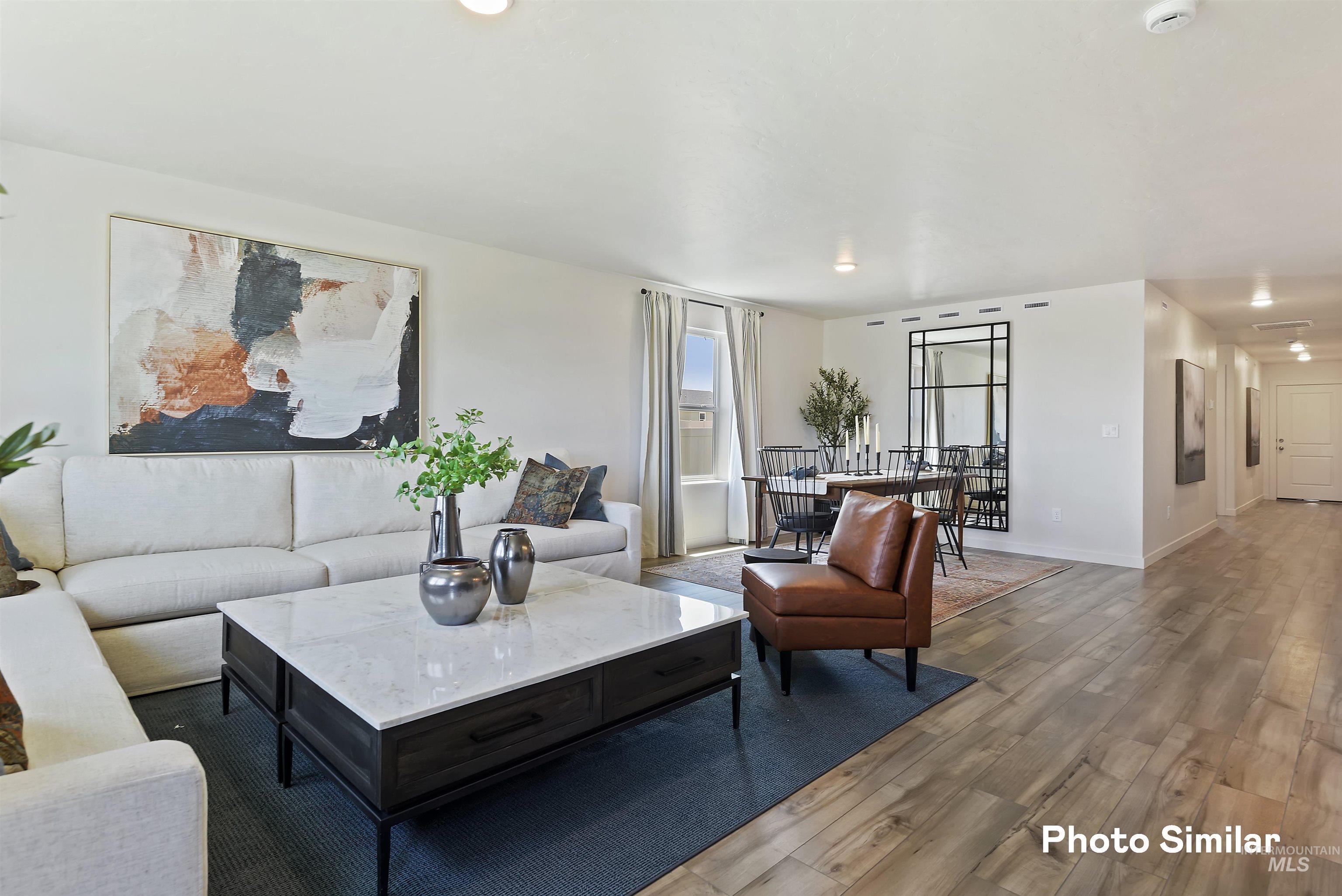 15182 Cumulus Way Caldwell, ID 83607 - Photo 6 of 26 Living area with dark wood finished floors and baseboards