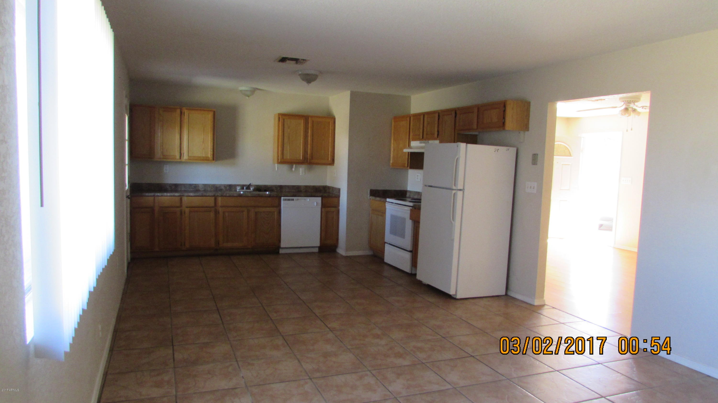 2320 East Cactus Road Phoenix, AZ 85022 - Photo 5 of 16 Kitchen Family Room