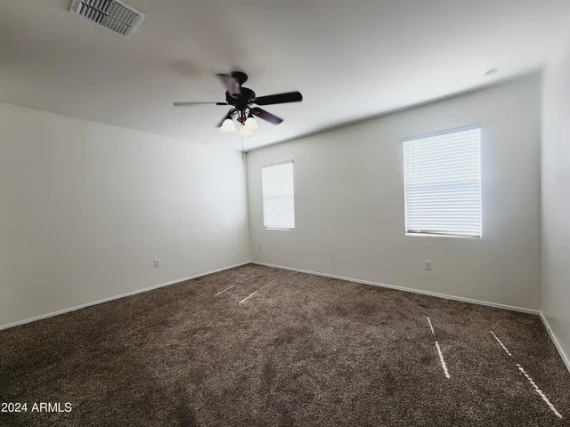 a view of a big room with carpet