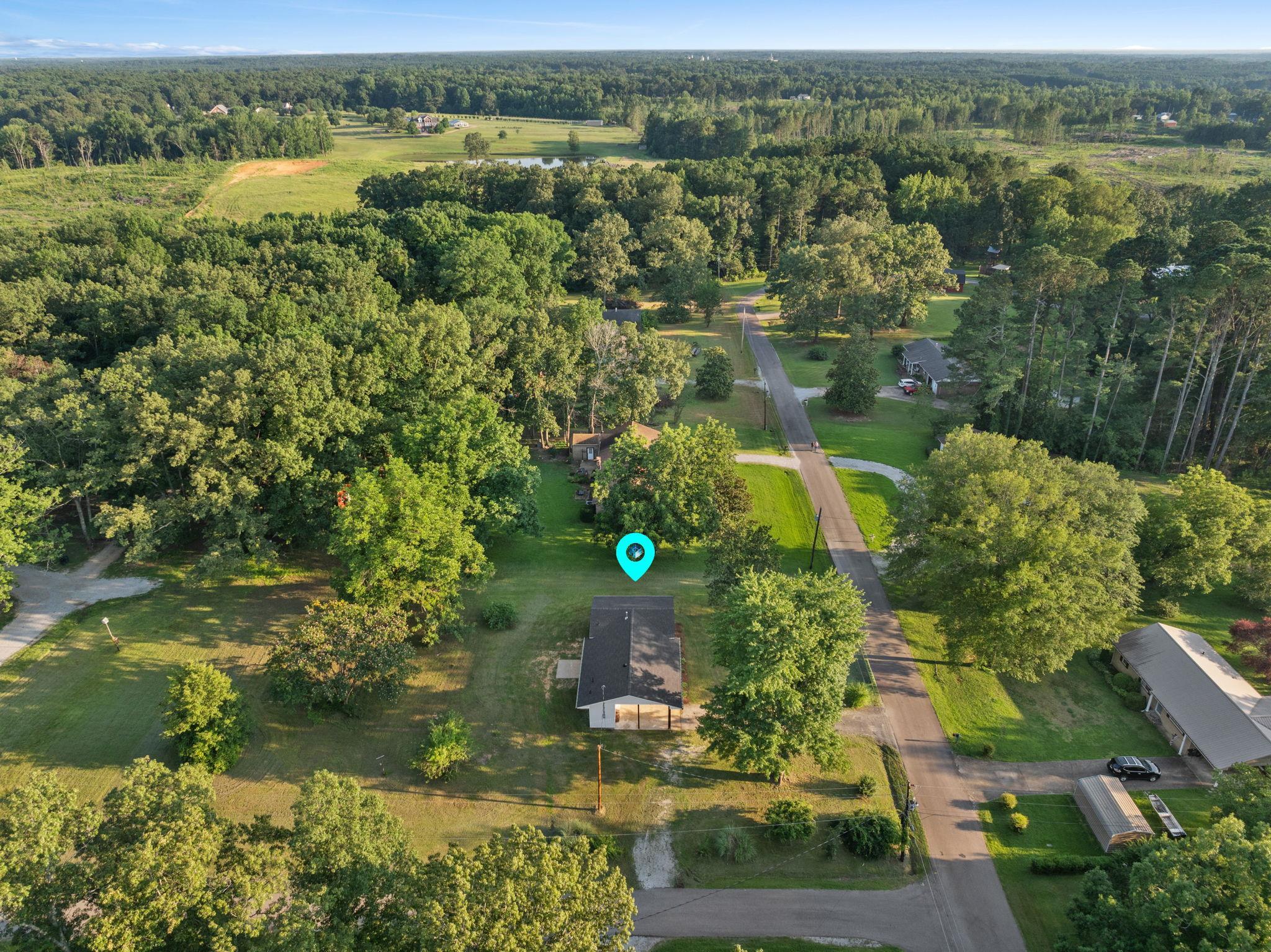 17 County Road 233 Corinth, MS 38834 - Photo 34 of 40 Aerial view of property and surrounding area featuring a forest