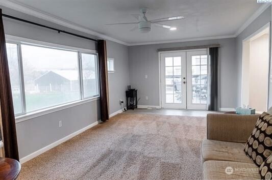 304 East 2nd Street Prescott, WA 99348 - Photo 14 of 24 a living room with a large bed and windows