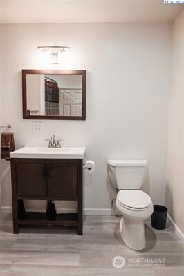 304 East 2nd Street Prescott, WA 99348 - Photo 17 of 24 a bathroom with a toilet sink and mirror