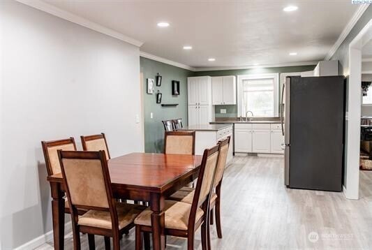 304 East 2nd Street Prescott, WA 99348 - Photo 10 of 24 a view of a dining room with furniture and a refrigerator