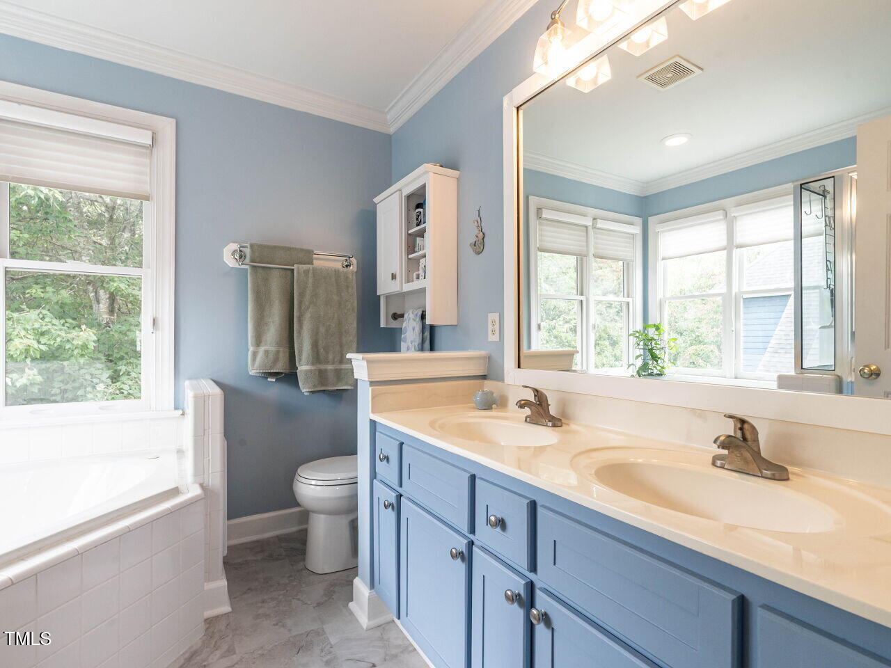9205 Dawnshire Road Raleigh, NC 27615 - Photo 18 of 30 a bathroom with a granite countertop sink mirror bathtub and toilet