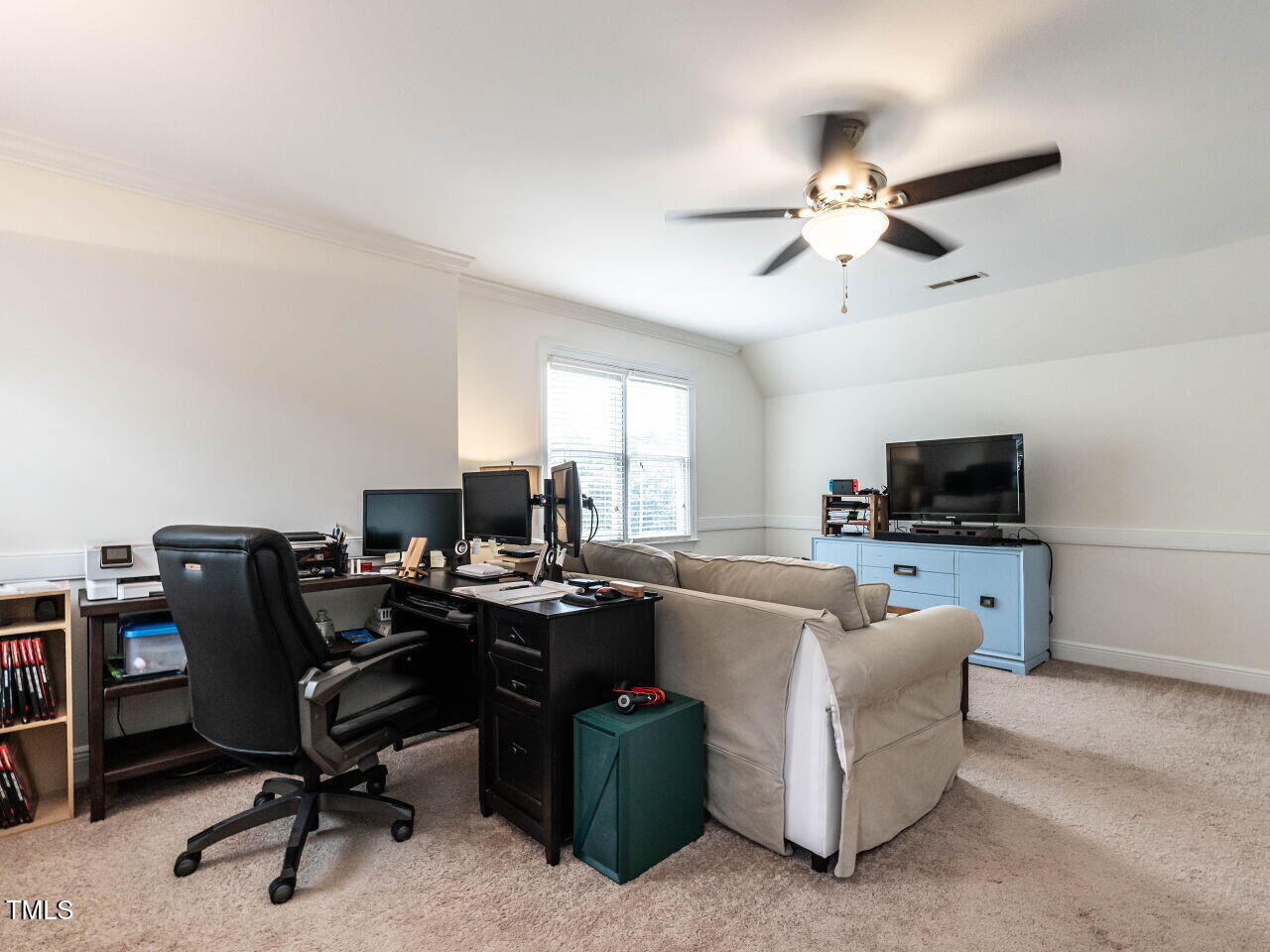 9205 Dawnshire Road Raleigh, NC 27615 - Photo 24 of 30 a view of a livingroom with workspace and a window