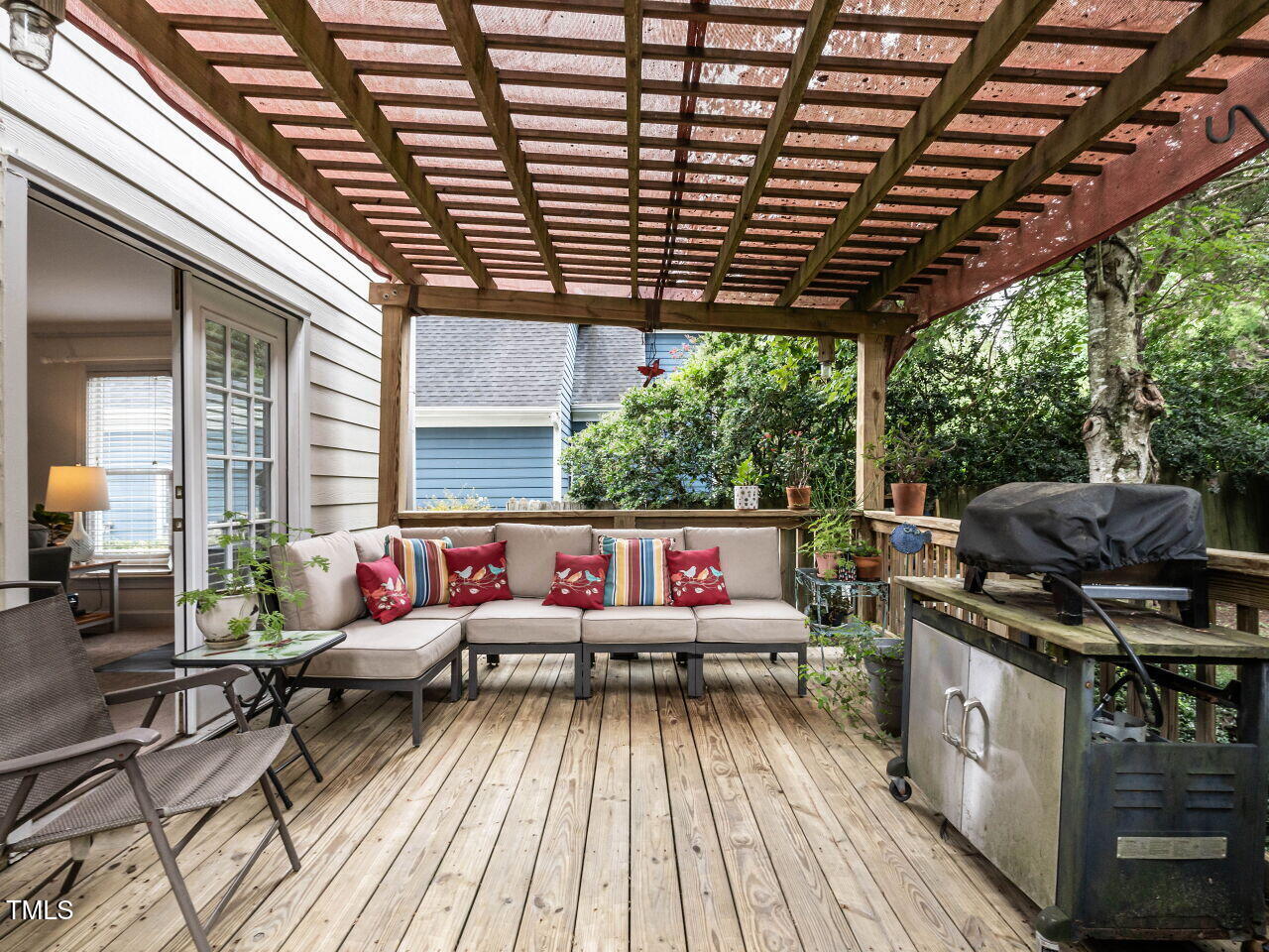 9205 Dawnshire Road Raleigh, NC 27615 - Photo 26 of 30 a living room with patio furniture and a grill