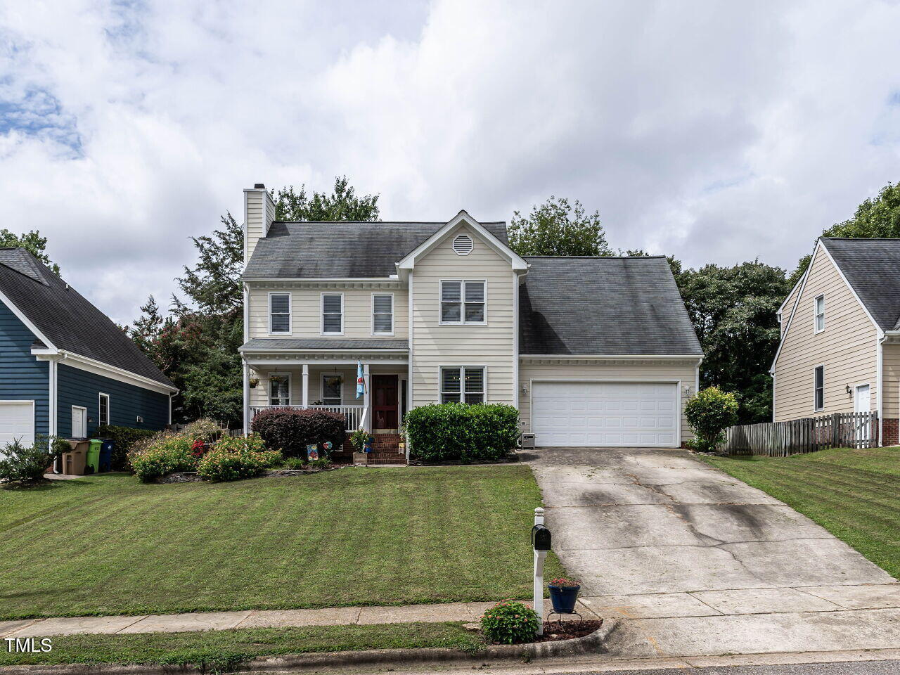 9205 Dawnshire Road Raleigh, NC 27615 - Photo 2 of 30 a front view of a house with a garden