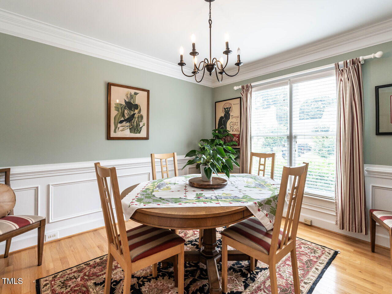 9205 Dawnshire Road Raleigh, NC 27615 - Photo 5 of 30 a view of a dining room with furniture window and wooden floor