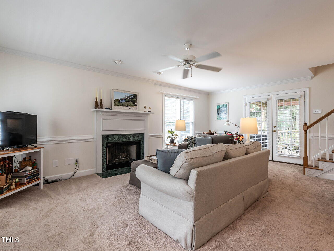 9205 Dawnshire Road Raleigh, NC 27615 - Photo 6 of 30 a living room with furniture and a fireplace