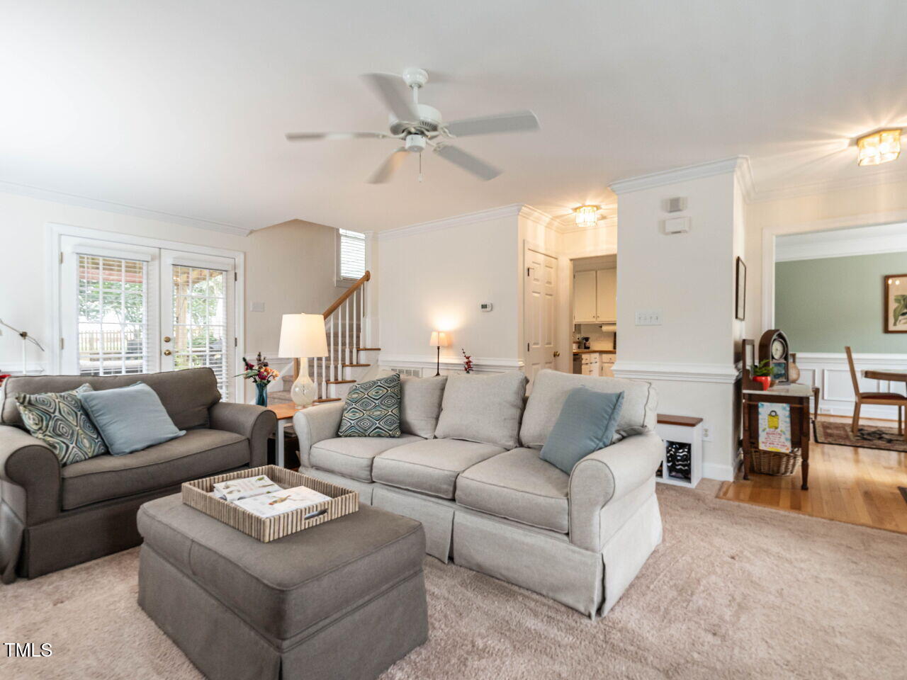 9205 Dawnshire Road Raleigh, NC 27615 - Photo 8 of 30 a living room with furniture a large window and a chandelier