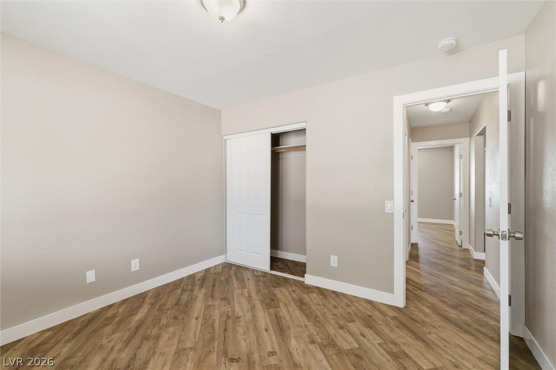 2780 West Simkins Road Pahrump, NV 89060 - Photo 32 of 40 Ample closet space complements the warm, durable wood flooring found throughout this inviting bedroom.