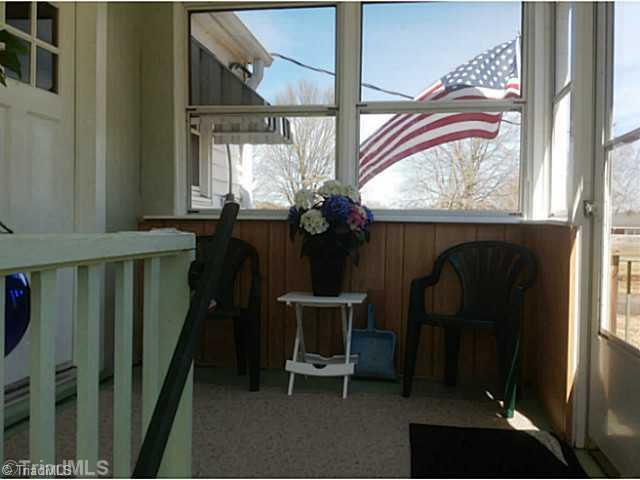 720 Redland Road Advance, NC 27006 - Photo 14 of 16 Sunroom. Sunny enclosed porch w/big stairway to basement