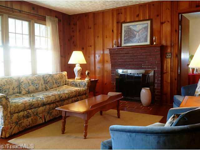 720 Redland Road Advance, NC 27006 - Photo 9 of 16 Living Room. Real wood burning brick fireplace