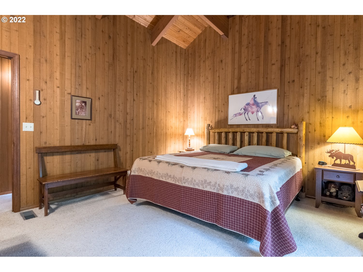 72671 East Village Loop Road Rhododendron, OR 97049 - Photo 25 of 32 a bedroom with a bed and a night stand