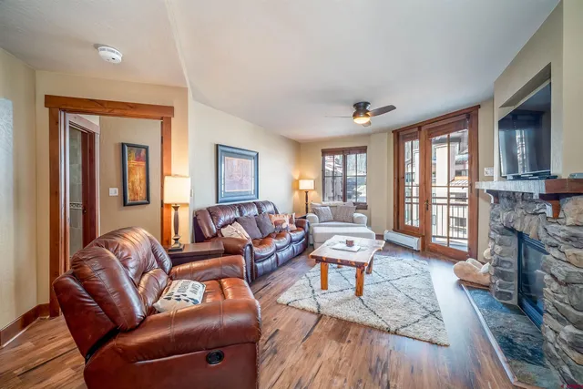 a living room with furniture and a fireplace