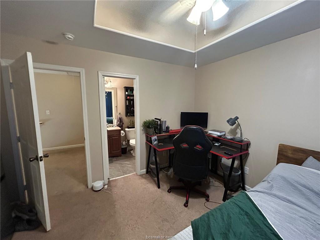 300 Ash Street, Unit B College Station, TX 77840 - Photo 14 of 23 a view of a workspace with furniture and a livingroom