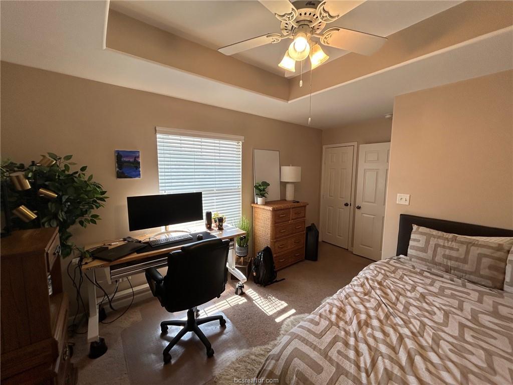 300 Ash Street, Unit B College Station, TX 77840 - Photo 17 of 23 a bedroom with a bed and a chandelier
