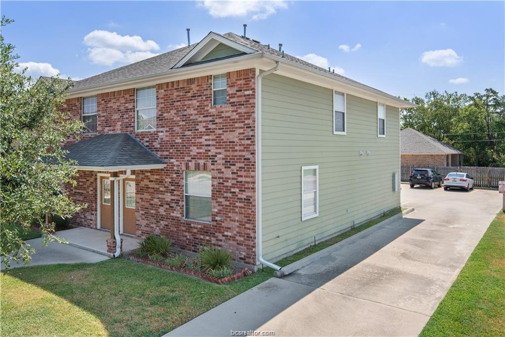300 Ash Street, Unit B College Station, TX 77840 - Photo 2 of 23 a front view of a house with garden