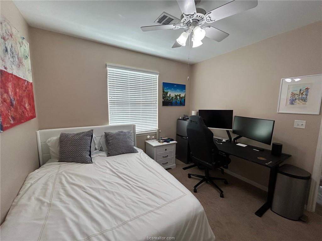 300 Ash Street, Unit B College Station, TX 77840 - Photo 8 of 23 a bedroom with a bed and a desk