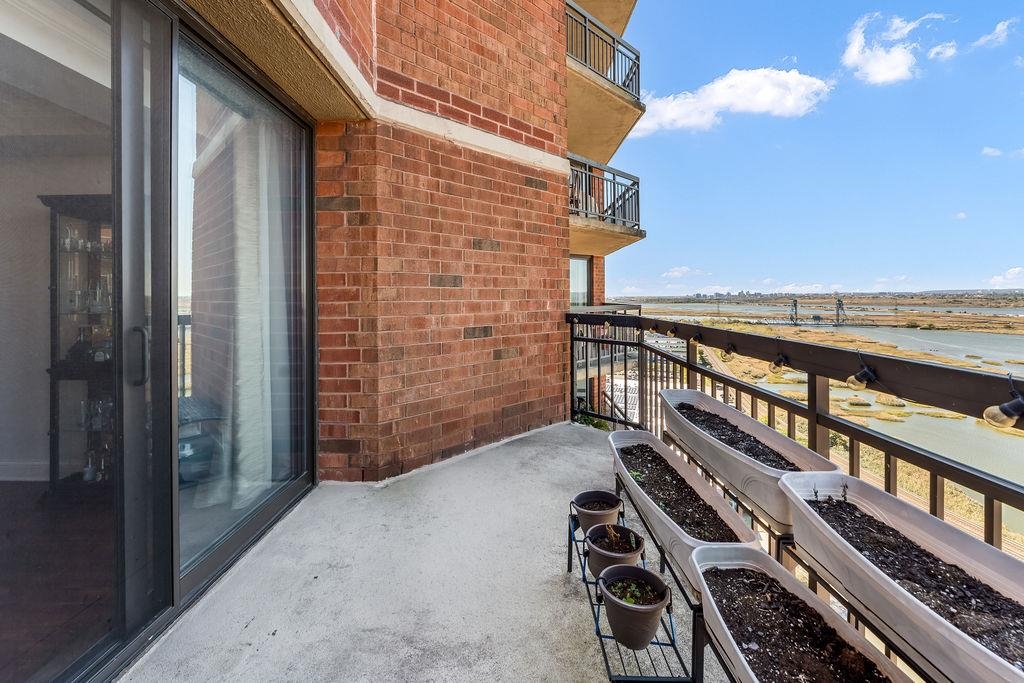 2110 Harmon Cove Tower Secaucus, NJ 07094 - Photo 35 of 50 a view of balcony with wooden floor