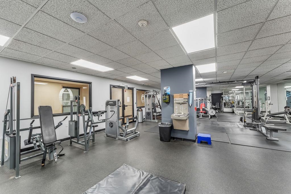 2110 Harmon Cove Tower Secaucus, NJ 07094 - Photo 40 of 50 a gym room with lots of furniture and white walls