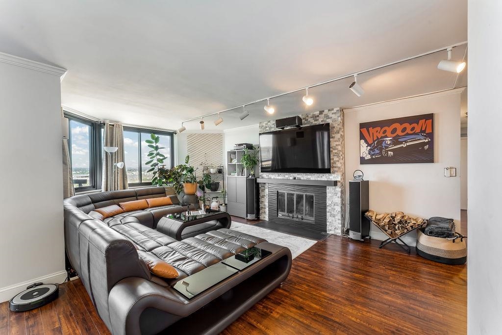 2110 Harmon Cove Tower Secaucus, NJ 07094 - Photo 4 of 50 a living room with furniture and a flat screen tv