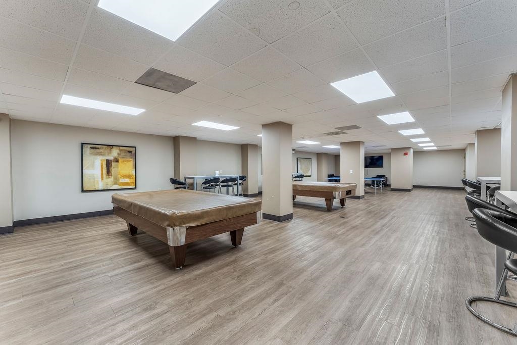 2110 Harmon Cove Tower Secaucus, NJ 07094 - Photo 45 of 50 a living room with furniture and a wooden floor